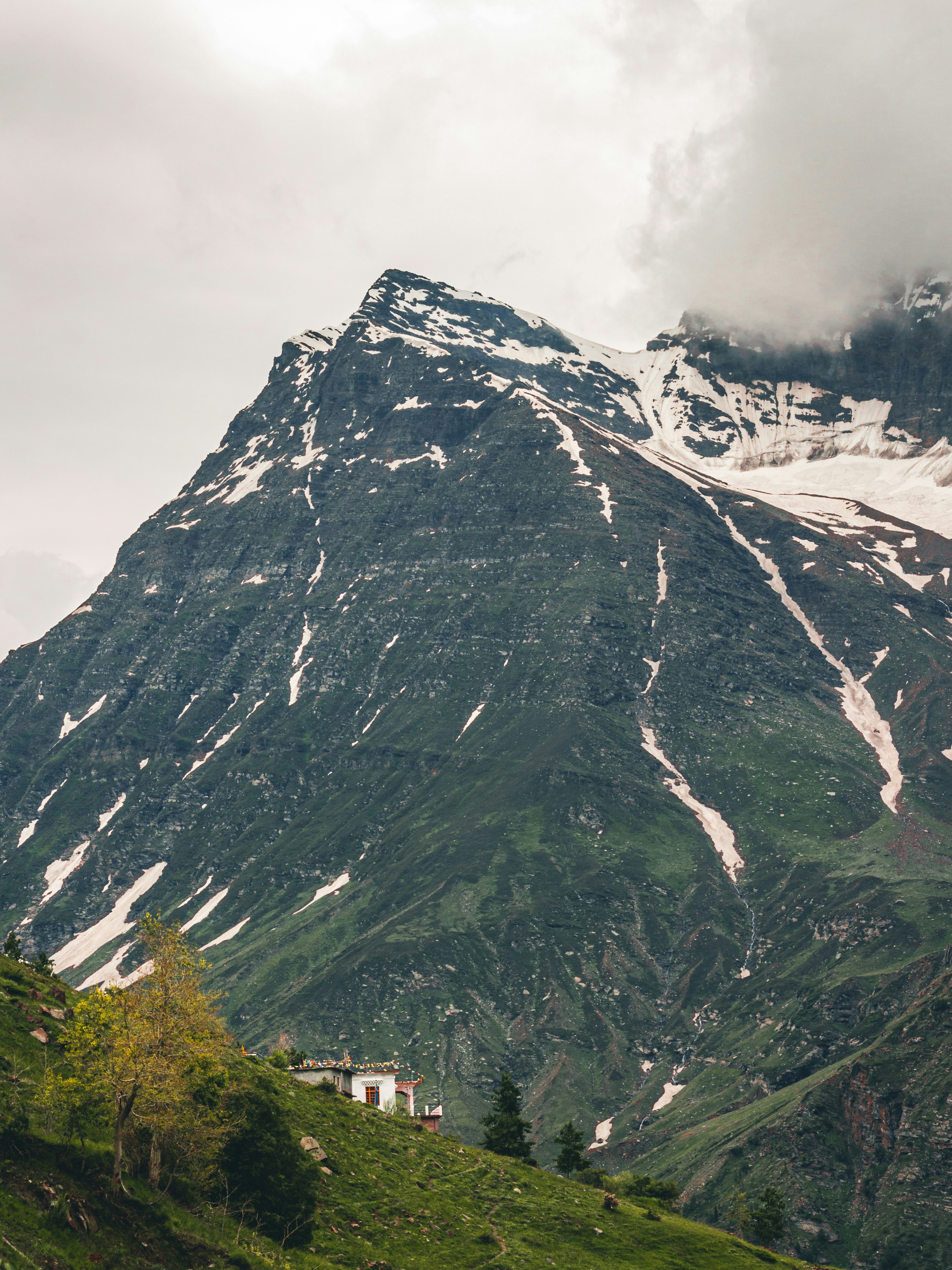 gray and white mountain under white sky during daytime